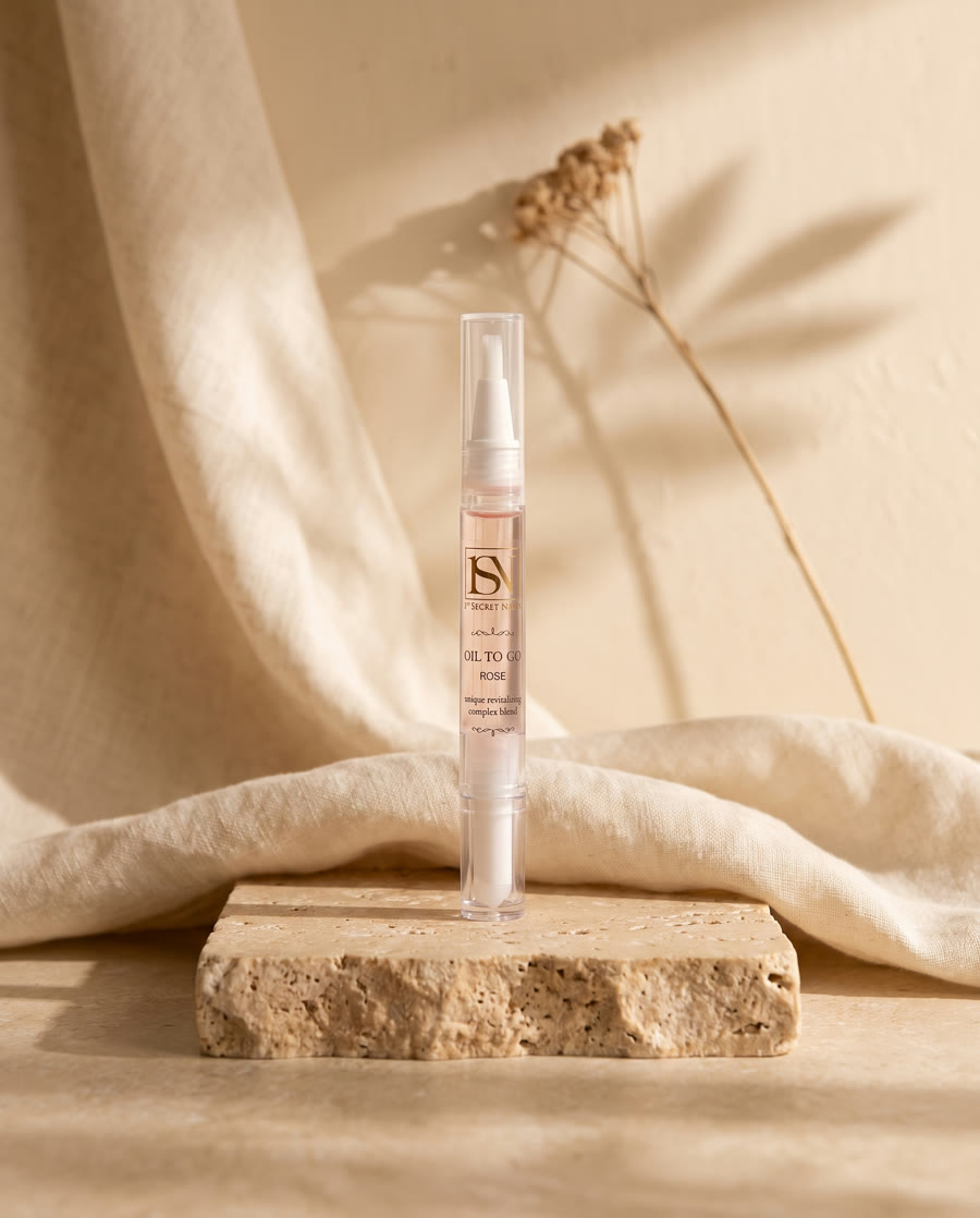 1st Secret Nails Oil To Go pen on travertine stone
